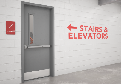 Red fire exit door in a hallway with bright lighting, white walls, and light-colored tile flooring.